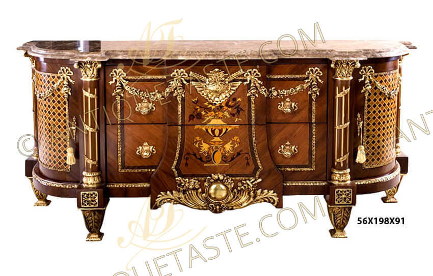 French Louis XVI style ormolu-mounted veneer inlaid parquetry and marquetry Bahut on the manner of Jean-Henri Riesener model, 19th century, The stepped breakfront marble top, centered to the front by a pair of veneer inlaid drawers headed by an ormolu sunburst winged cartouche mount and ribbon-tied floral blossoms garlands, with central break-fronted panel inlaid with a marquetry pattern of flowers basket and leaflike motifs, above a fleur-de-lys-studded ormolu globe and cornucopia mount, the drawers are surrounded with hammered ormolu strip to the contour, flanked to each side by gilt-fluted ormolu entwined roman style columns supports with an ormolu Corinthian capitals. On each side a veneer inlaid parquetry style trellis cupboard door with, hung with ribbon-suspended blossoming garlands and another two colonnettes to the far corners. The D-shaped base is ornate with a hammered ormolu filet and break-fronted blocks ornamented with ormolu pierced flower rosettes and raised on tapering gilt-ormolu acanthus-mounted feet